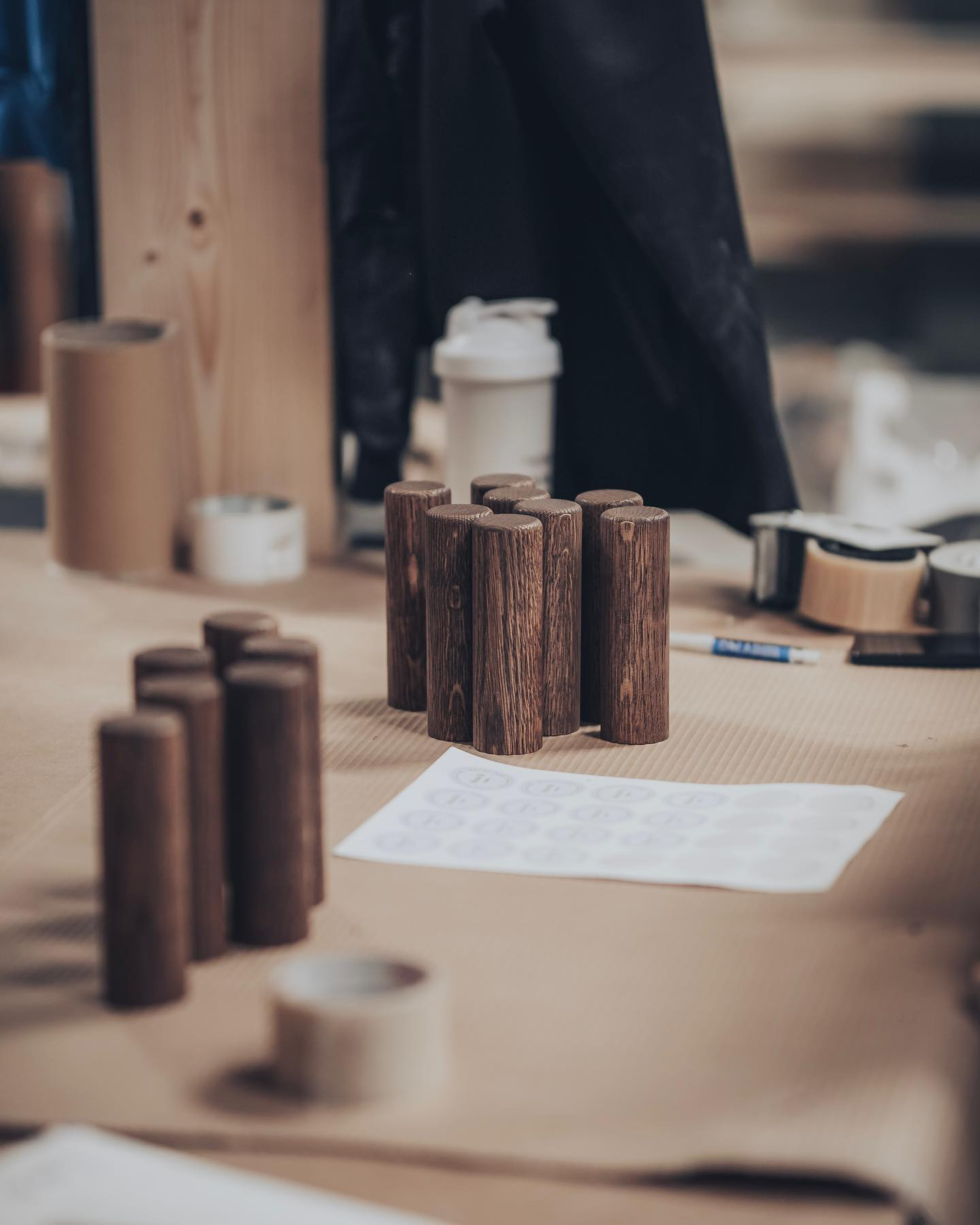 Dark wood finish samples on a worktable
