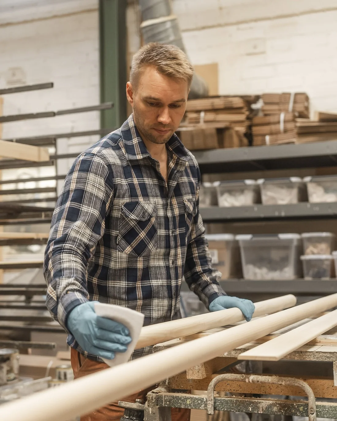 Craftsperson working with wooden handrails in our workshop in Dalarna, Sweden